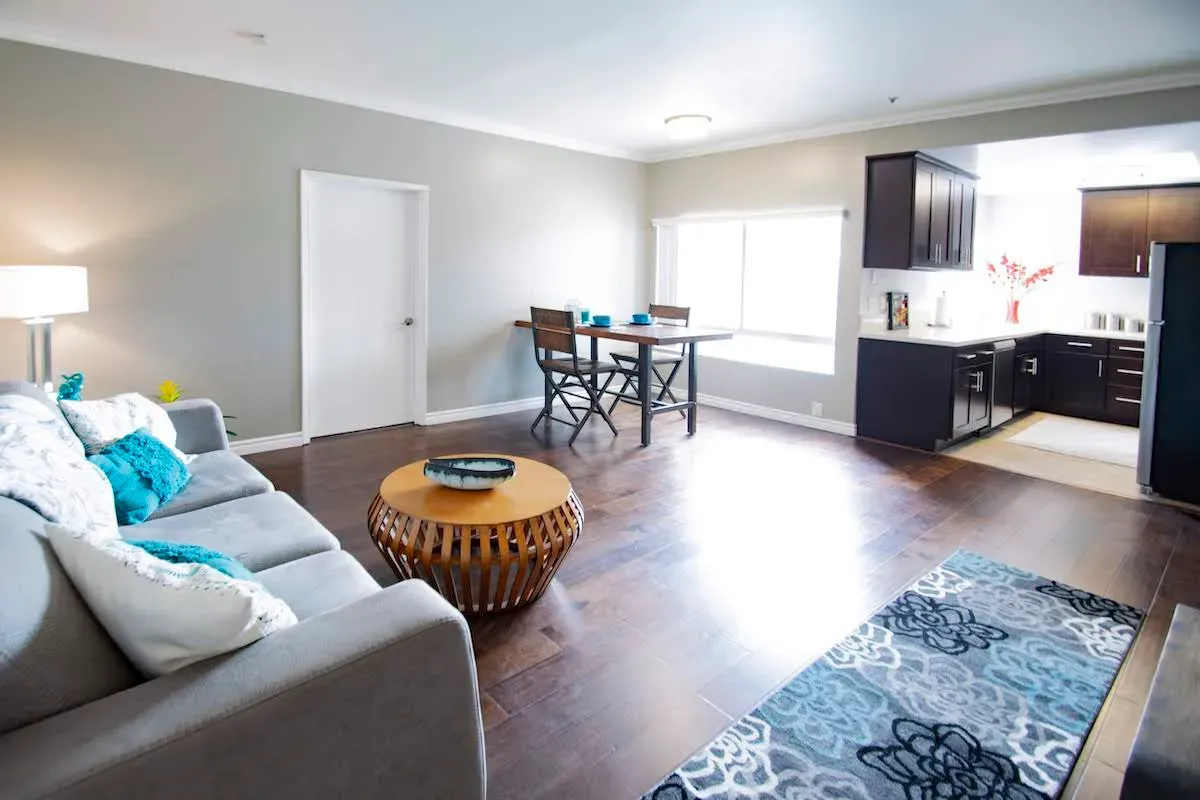 Living room with sofa and open kitchen